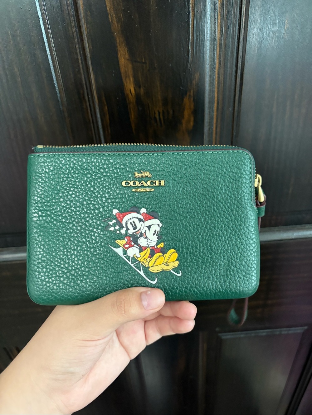 COACH Green Pebbled Leather Wristlet with Mickey & Minnie Ski Print